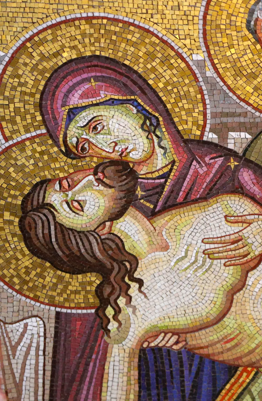 Mosaic detail of the deposition: Mary cradling the head of her son against a field of gold.